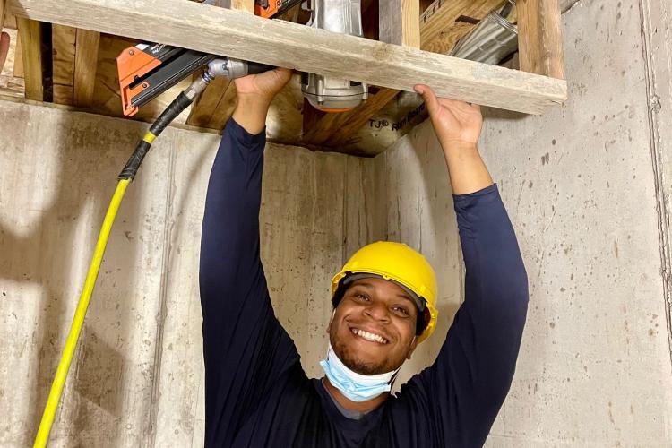 Derek Winbush working at a site.