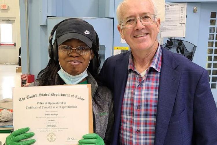 Jerrittia Roseburgh being presented with her certificate.