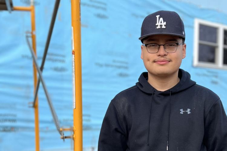 Portrait of Cesar Mejia at a worksite. 