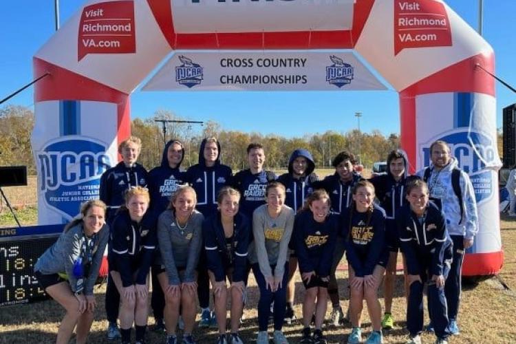 Cross country team members posing at the NJCAA National Tournament in November.