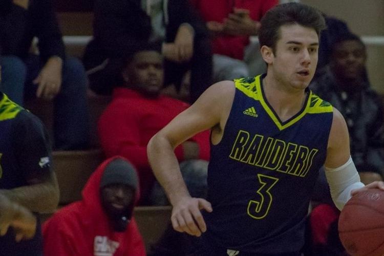 Zachary Pangborn dribbles the ball.