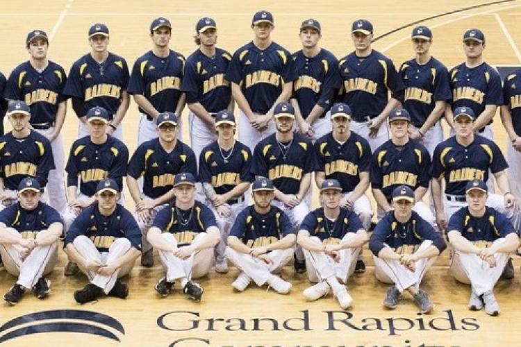 The members of the 2017-18 baseball team are in three rows -- sitting, kneeling and standing -- in the fieldhouse gym.