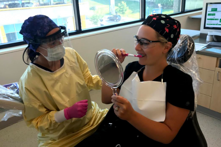 GRCC dental students practice brushing instruction.