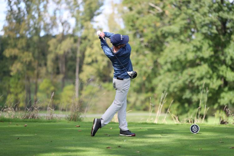 Tyler Hausserman following through on a swing.