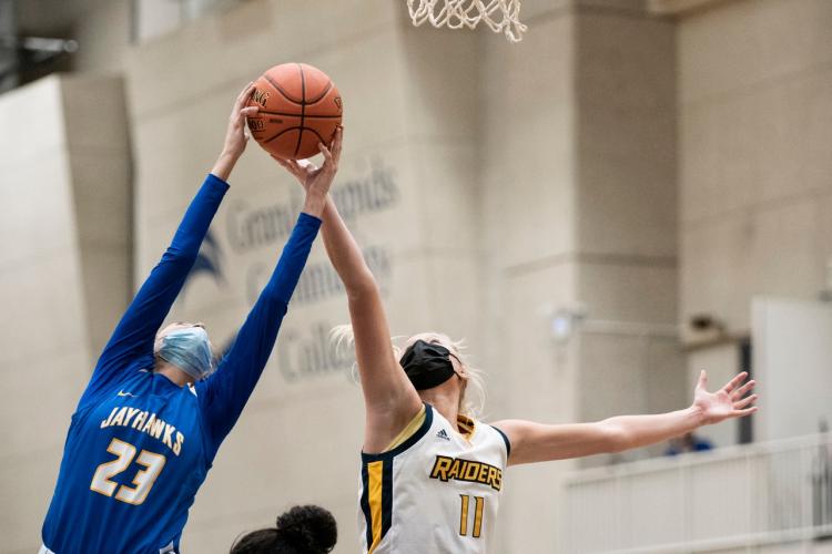 Danielle Lamancusa reaches to grab a rebound.