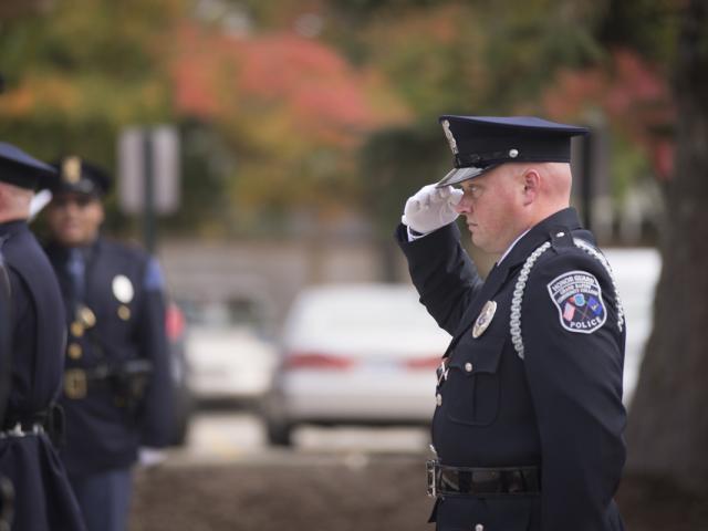 police officer saluting.