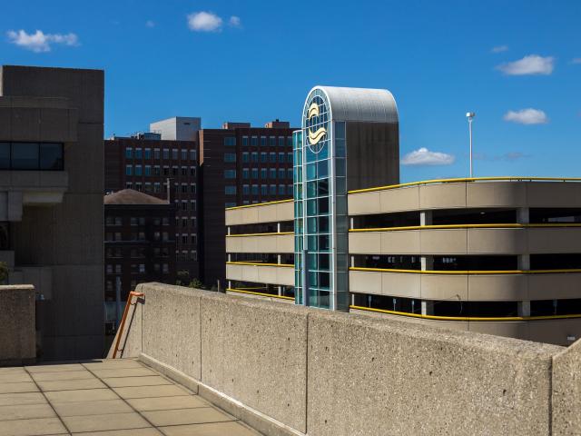 Bostwick Parking ramp with the college seal.