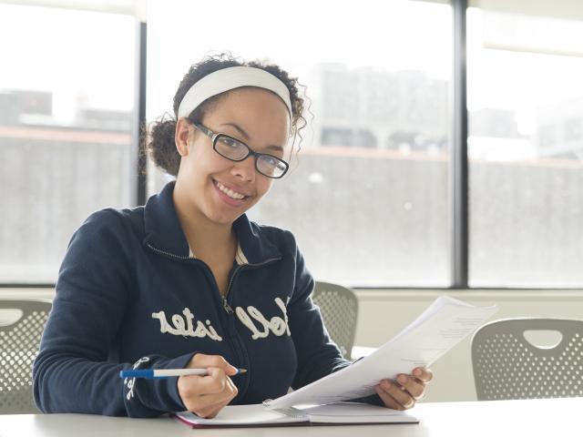 A GRCC student studying in a classroom