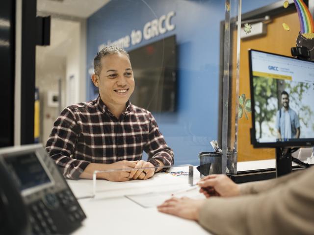 Student being helped at the Student Financial Service office